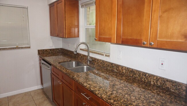 Building Photo - Four Bed - Three Bath - Large Storage Area...