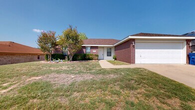 Building Photo - Completely repainted 4 bedroom ALL TILE ho...