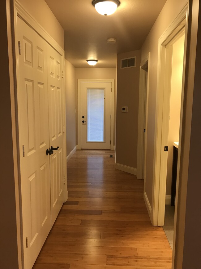 Hallway to laundry, bath, bedrooms, and patio. - 100 Scenic Drive