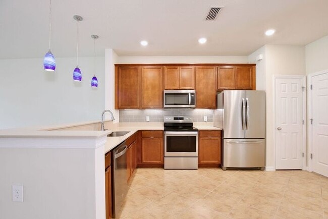 Building Photo - Immaculate Townhome · Dual En-Suite Bedrooms + Flex Loft · Cable & Internet Included · 3.5 Miles ...