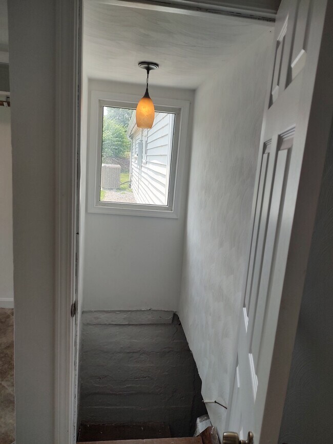 Stairs to crawl space/laundry hookups from 3rd BR - 4011 Bandy Rd