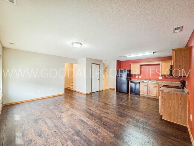 Building Photo - Bright & Spacious Waukee Townhome Near Dining, Shopping & Entertainment and attached 2-car garage