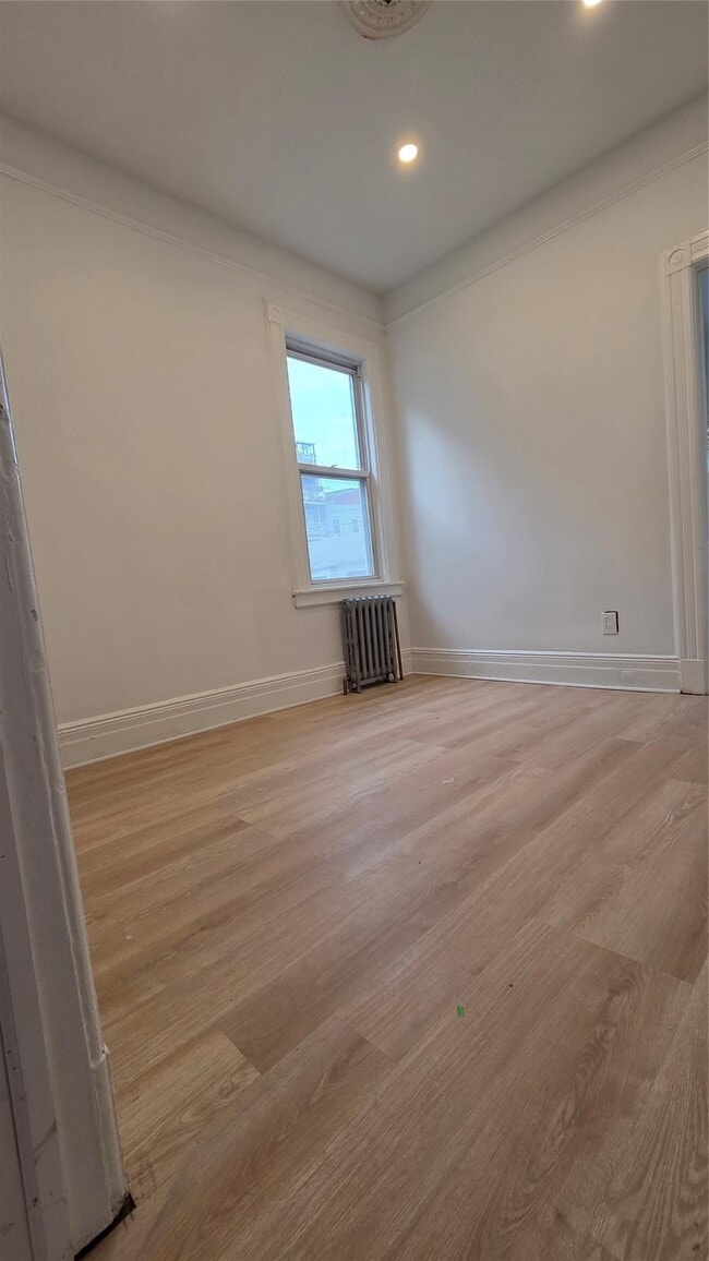 Building Photo - 42-21 65th Pl
