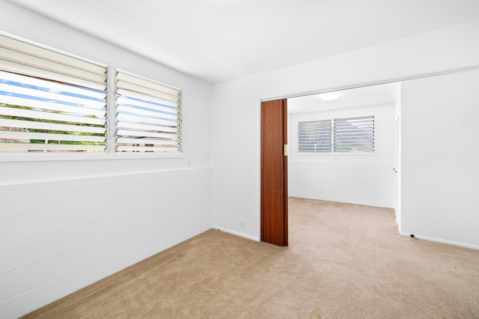 Bedroom (2 flex) with accordion room divider and closets on both sides. - 45-162 Neepapa Pl