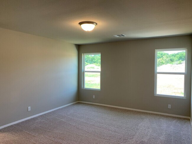 Building Photo - This well-designed 4-bedroom home has a split floor plan that gives the feeling of space.