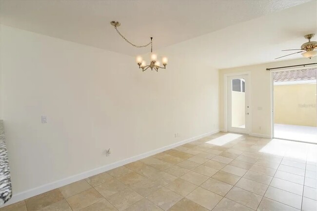 Family room with door to back patio - 8438 Gilford Ln