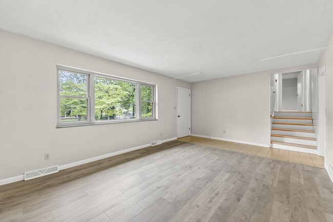 Living room with new flooring. - 1618 Oak Hills St
