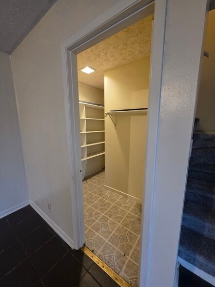 Lower level walk in closet - 9102 Woodpark Ln