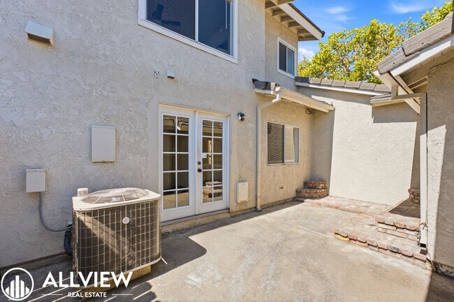 Building Photo - Fully Renovated 2 Bed Townhome with Private Patio, 2-Car Garage & Community Pool