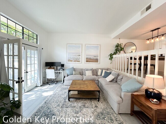 Building Photo - Welcome to this stunning ***unfurnished*** tri-level condo in the desirable Casitas de la Costa c...