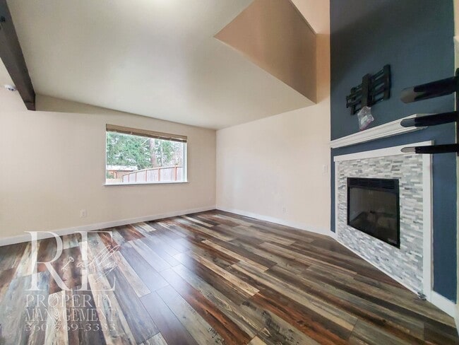 Building Photo - Modernized Two-Story with Open Layout, Gas Fireplace & Large Fenced Yard