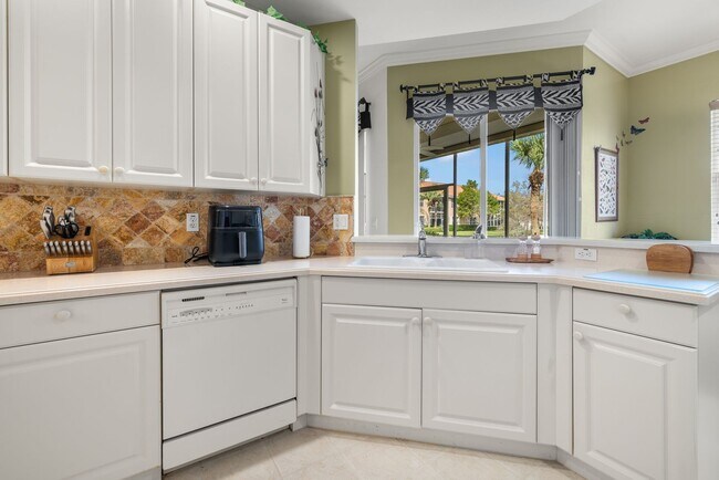 Building Photo - Experience Bell Tower Park. GATED ground floor 2 Bed 2 Bath Den 1 Car Garage Condo.