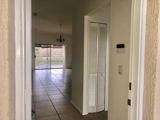 Building Photo - Nice 2X2 located on 2nd floor- Tile & lami...