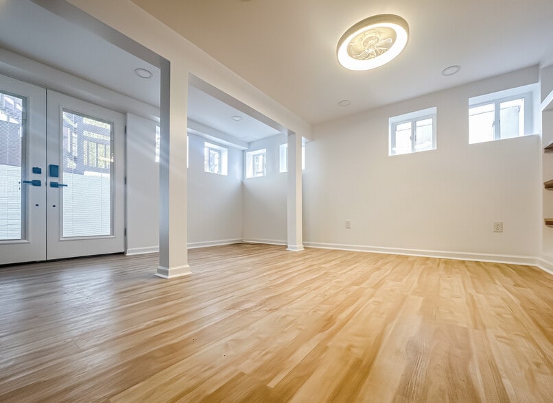 Spacious multi-purpose room with fireplace and French doors (2025 addition) - 6471 Grommet Dr