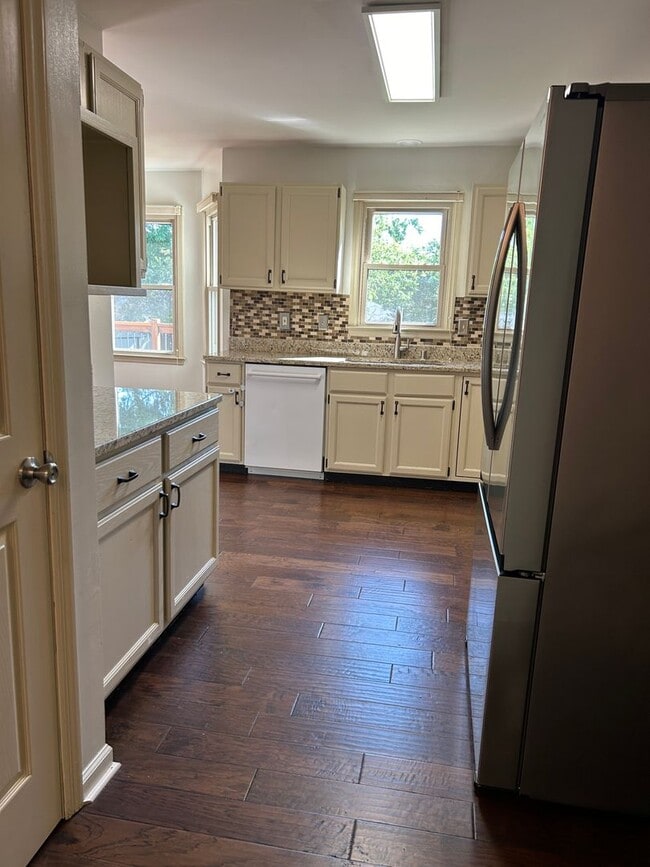 Building Photo - 4 Bedrooms with Finished Basement and Bonu...