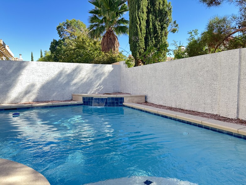 Pool with small landing, solar heat, water feature and color changing LED light. - 3320 Haven Beach Way