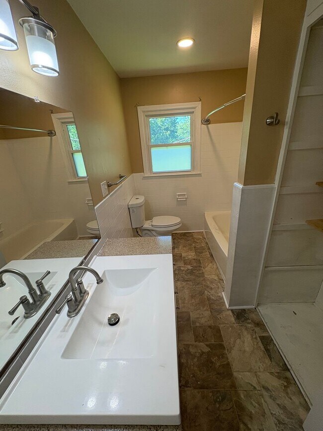 Building Photo - Spacious 4 Bed / 2.5 Bath Home on Nearly 3/4 Acre Lot with Walkout Basement and Multiple Living A...