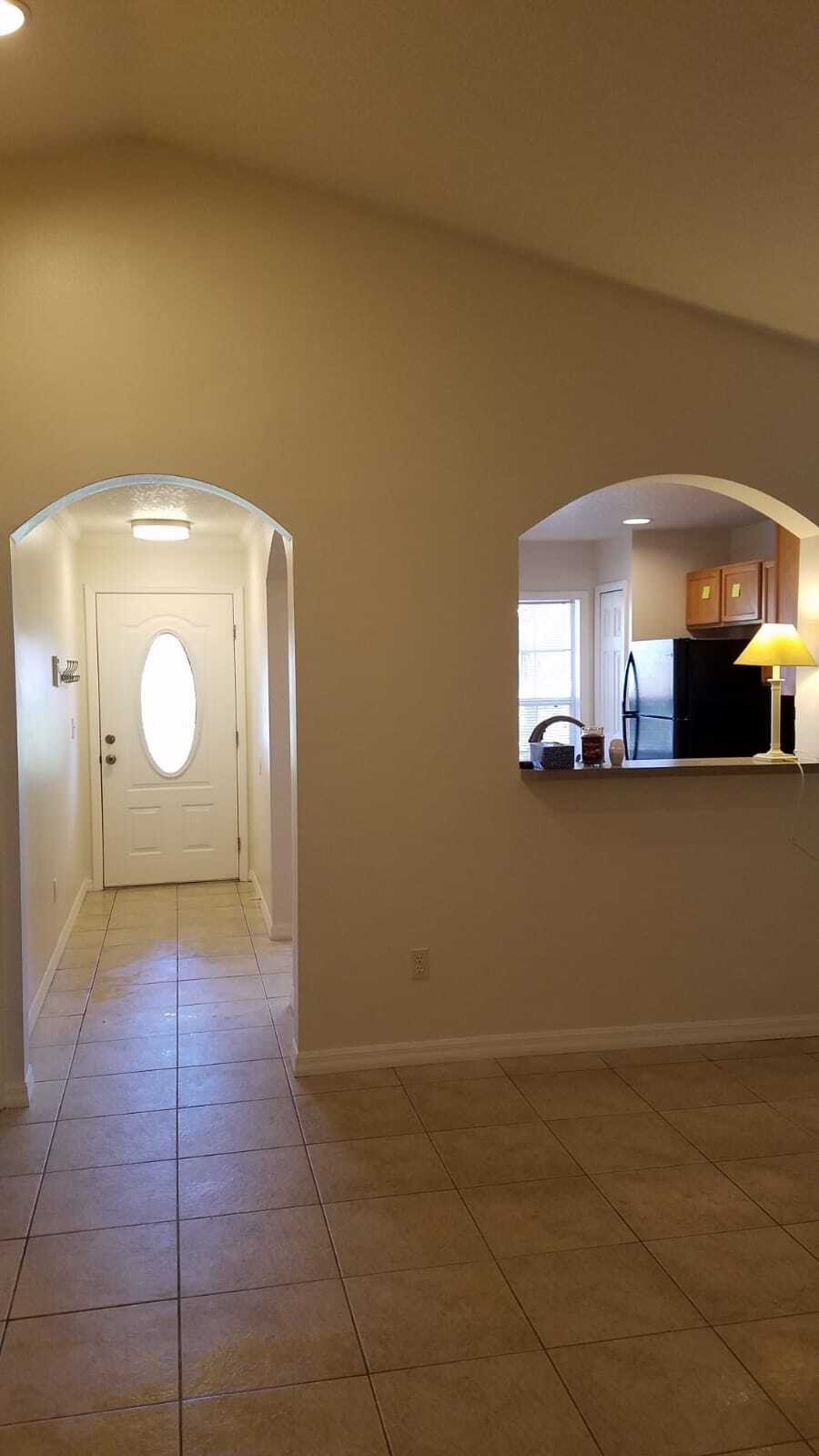 Living room looking into front doorway - 2306 S Bumby Ave