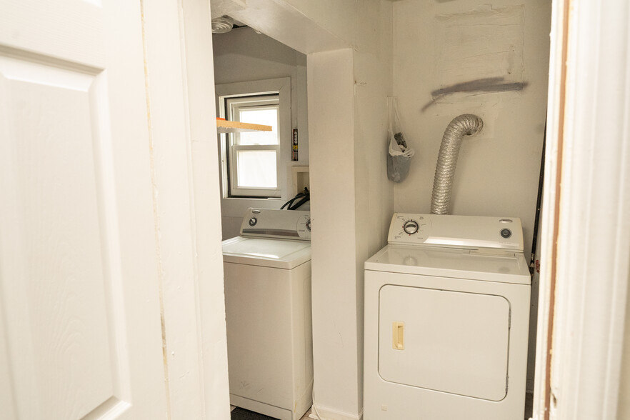In-unit laundry room with back door to yard - 3350 W Cuyler Ave