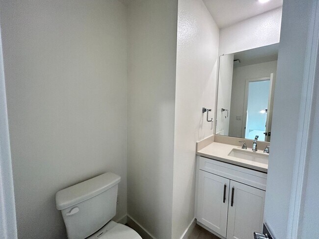 Building Photo - Gorgeous, 3 level townhome, featuring 2 car garage central Air, and in Unit laundry.