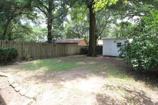 Building Photo - 2BR Home with Wood-Look Flooring, Fenced Backyard & Private Patio
