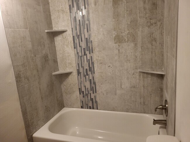 MIL Bathroom shower new tile - 1704 N Stone St