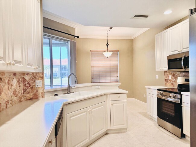 Building Photo - Experience Bell Tower Park. GATED ground floor 2 Bed 2 Bath Den 1 Car Garage Condo.