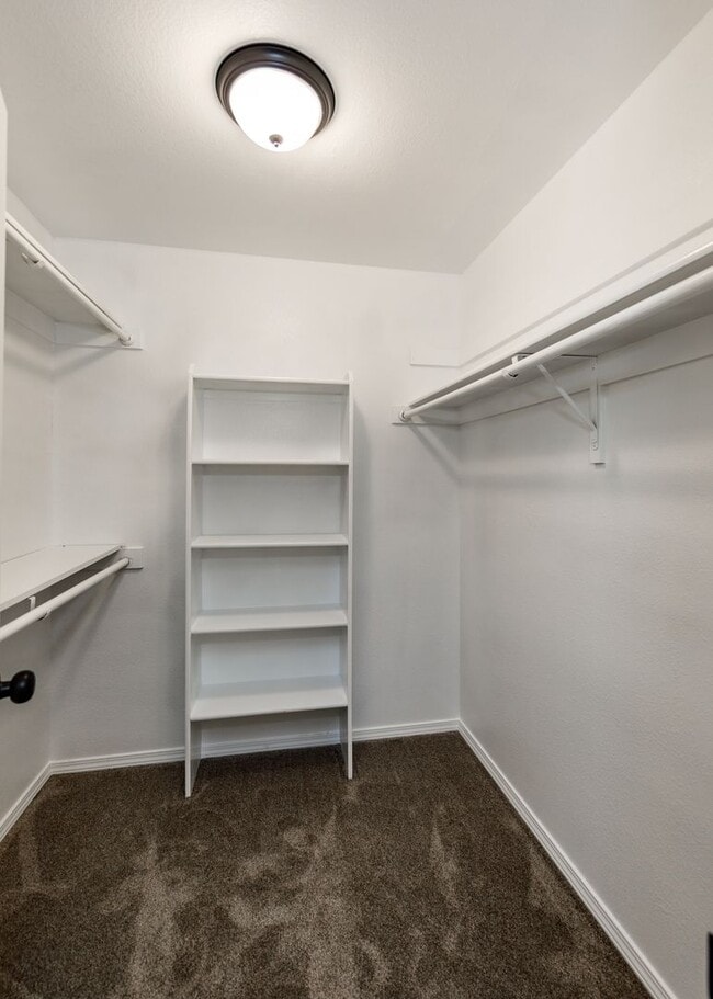 Building Photo - 3 Bed Top Floor Condo near Ft. Carson in Gated Community with detached Garage