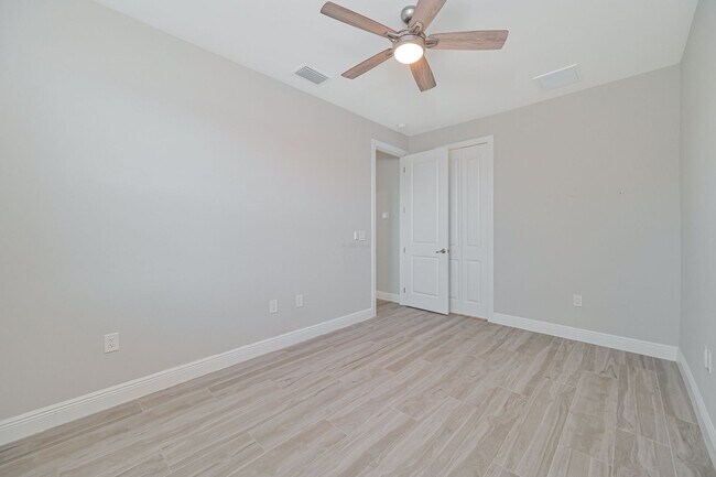 Building Photo - NOW AVAILABLE - Gorgeous Pool Home ~ NW Cape ~ 3 Car Garage ~ On Canal!