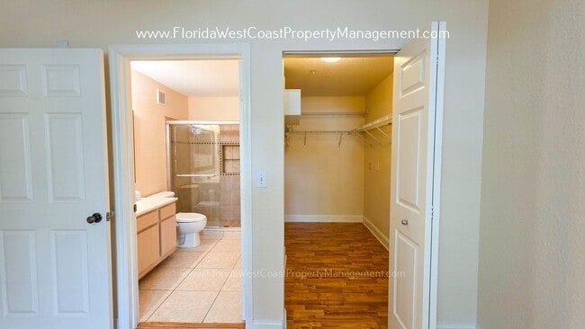 Building Photo - MOVE IN READY! LARGE 2 BEDROOM/2 BATH PLUS ATTACHED GARAGE! TILE/LVP THROUGHOUT!