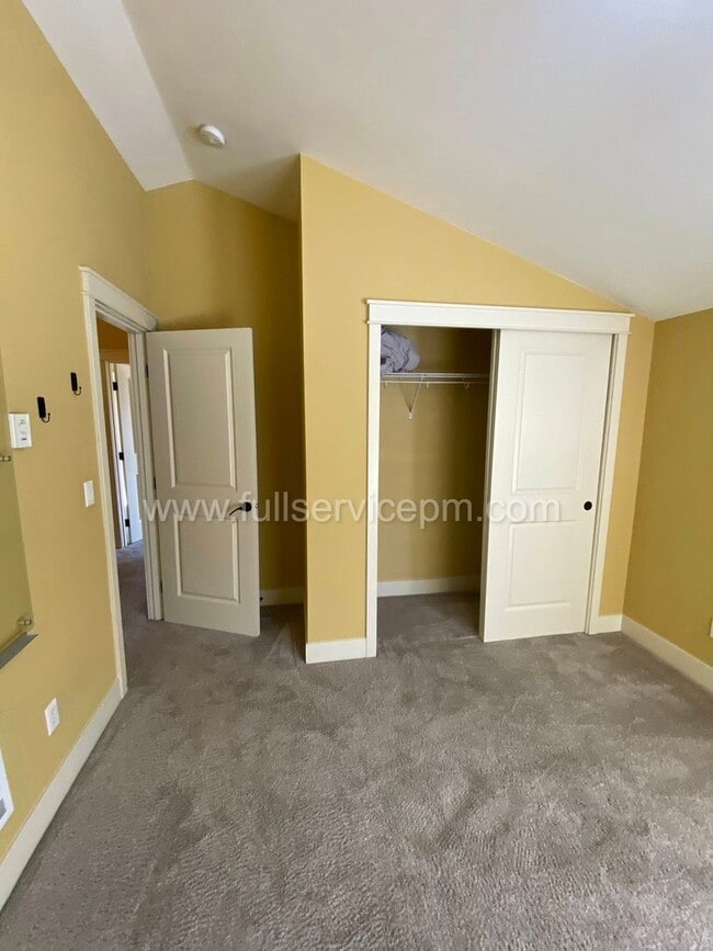Building Photo - Spacious townhome with private backyard, garage parking, multiple decks, and a dedicated home off...