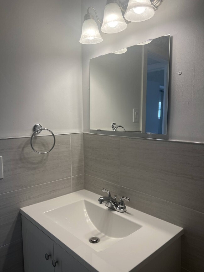 Newly renovated bathroom with window - 5010 SW 26th Ave