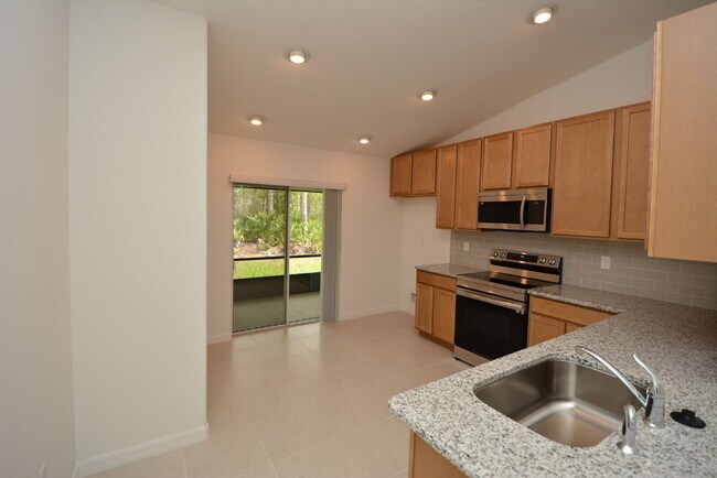Building Photo - "Charming 3-Bedroom Duplex with Granite El...