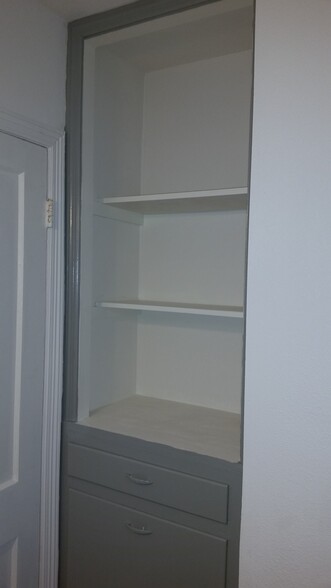 Plenty of storage with a built in laundry hamper. - 2625 Cincinnati Ave