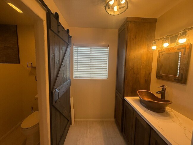 Building Photo - 4BR/2BA HOME w/ attached garage, usable land, fenced in back yard in CAMPO available!