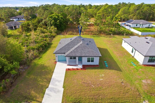 Building Photo - Brand New 4-Bedroom Gem with 2 Full Baths on Large Lot in Lehigh Acres – A Perfect Family Haven!