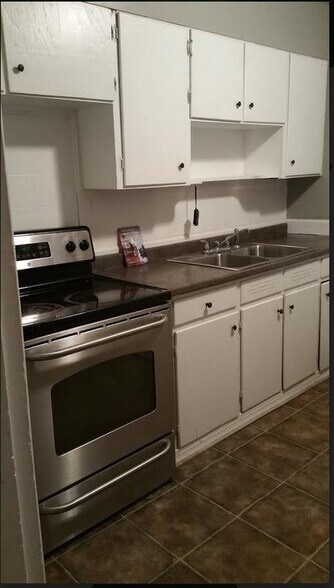 Kitchen with stainless steel appliances - 8428 9th Ave S