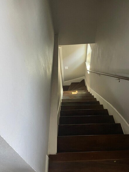 Stairs going up to the condo - 204 E 30th St