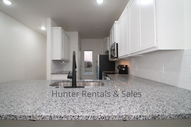 Building Photo - Upscale Four-Bedroom Townhome!