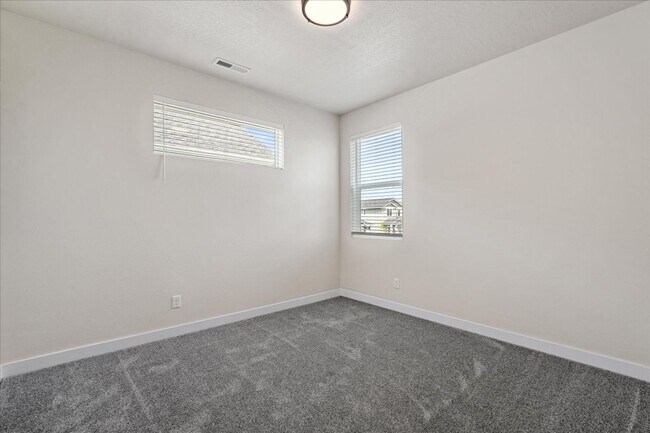 Building Photo - Brand New, Stylish 4-Bedroom Home with Vaulted Ceilings and Private Patio