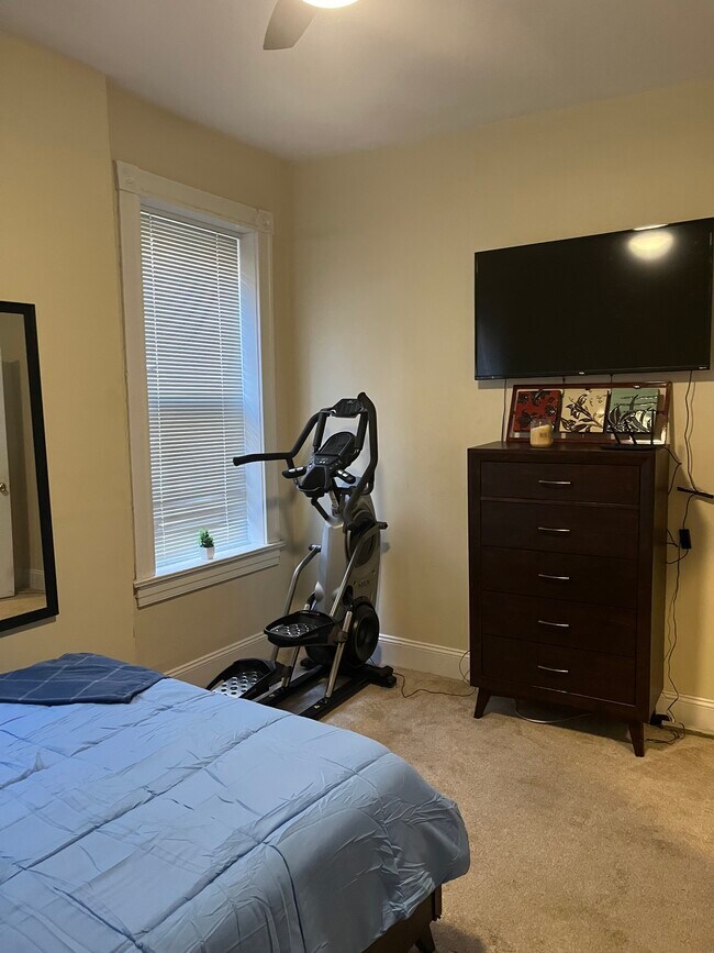 Primary Bedroom - Queen Sized Bed; 55-inch 4K Ultra Smart TV; Max Trainer 7 - 2219 Missouri Ave