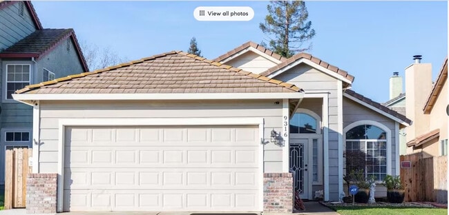 2 car side by side with Auto Garage Door - 9316 Caulfield Dr