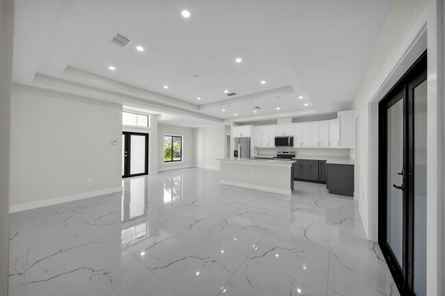 Building Photo - Brand-New Home in Lehigh Acres – Move-In Ready! FL 33974. Qualify for a deposit-free option and s...