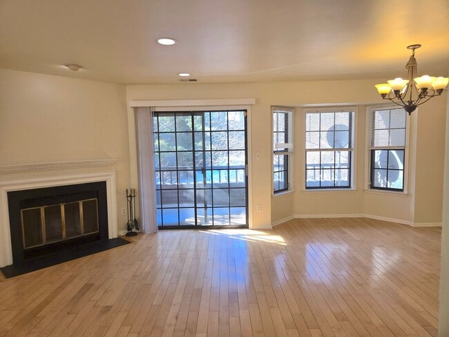 Building Photo - Commuter's delight! Spacious 2nd fl: 2-bed, 2-bath condo with fireplace, washer & dryer & off-str...