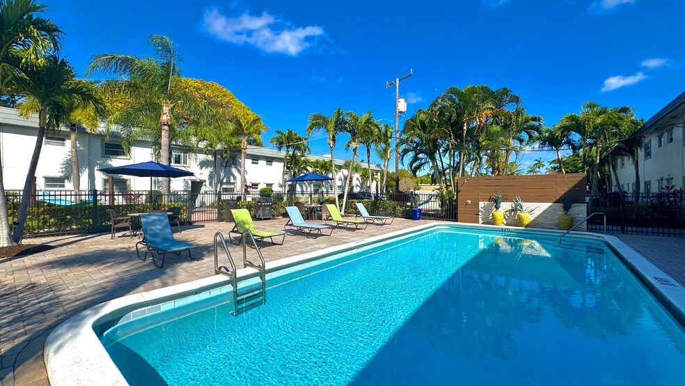 Soak up the Florida sunshine at our sparkling swimming pool. - Boca Winds