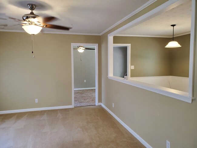 View of Den and Diningroom from Livingroom - 4521 Mellowood Cir