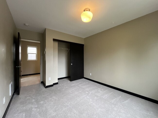 Building Photo - Charming 3 Bedroom, 2.5 Bathroom Home with Large Living Room, Tall Windows, Island Kitchen, and A...