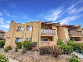 Building Photo - Bright & Updated 2-Bed Condo in Gated Vill...