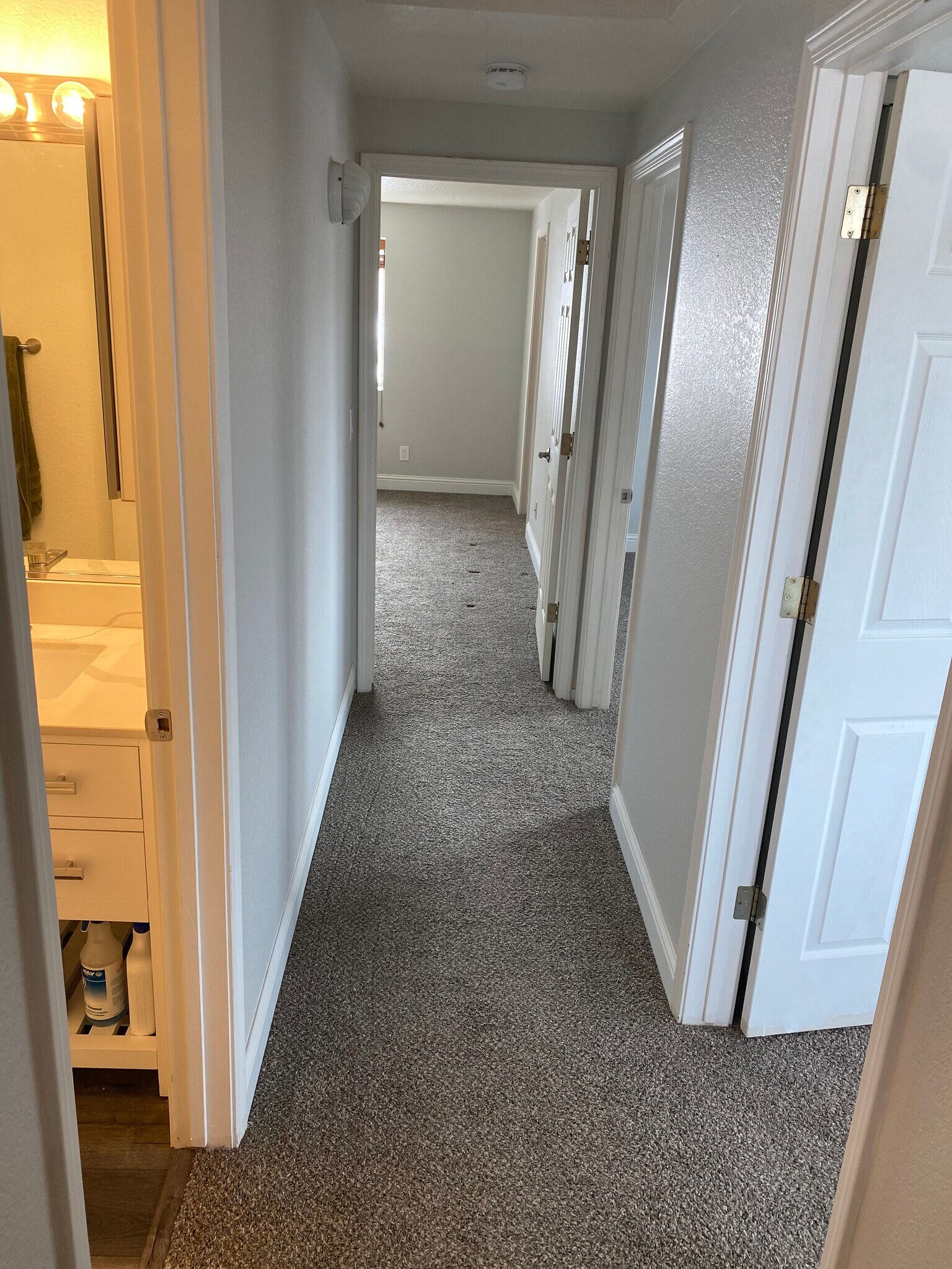 Upstairs hallway with bedrroms on right and bathroom on left - 17110 Waxwing Ct