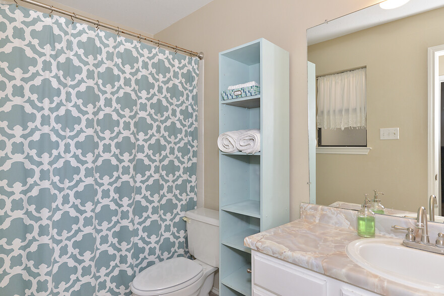 Bathroom with tub - 13035 Brook Garden Ln